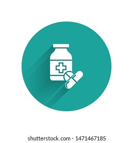 White Medicine bottle and pills icon isolated with long shadow. Bottle pill sign. Pharmacy design. Green circle button. Vector Illustration