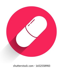 White Medicine pill or tablet icon isolated with long shadow. Capsule pill and drug sign. Pharmacy design. Red circle button. Vector Illustration