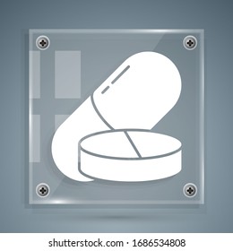 White Medicine pill or tablet icon isolated on grey background. Capsule pill and drug sign. Pharmacy design. Square glass panels. Vector Illustration