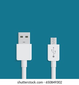 White micro USB cables on blue background. Connectors and sockets for PC and mobile devices. Computer peripherals connector or smartphone recharge supply