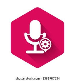 White Microphone and gear icon isolated with long shadow. Adjusting app, service concept, setting options, maintenance, repair, fixing. Pink hexagon button. Vector Illustration