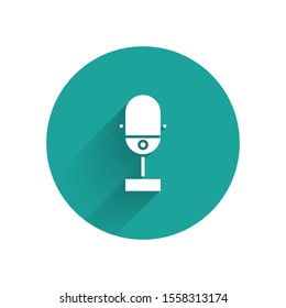 White Microphone icon isolated with long shadow. On air radio mic microphone. Speaker sign. Green circle button. Vector Illustration