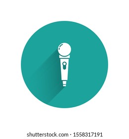 White Microphone icon isolated with long shadow. On air radio mic microphone. Speaker sign. Green circle button. Vector Illustration