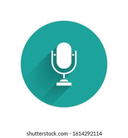 White Microphone icon isolated with long shadow. On air radio mic microphone. Speaker sign. Green circle button. Vector Illustration