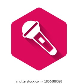 White Microphone icon isolated with long shadow. On air radio mic microphone. Speaker sign. Pink hexagon button. Vector.