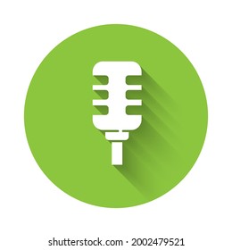 White Microphone icon isolated with long shadow. On air radio mic microphone. Speaker sign. Green circle button. Vector