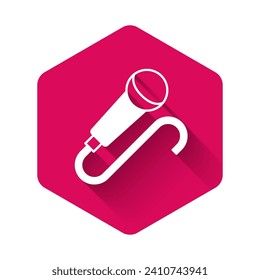 White Microphone icon isolated with long shadow background. On air radio mic microphone. Speaker sign. Pink hexagon button. Vector