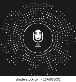 White Microphone icon isolated on grey background. On air radio mic microphone. Speaker sign. Abstract circle random dots. Vector Illustration