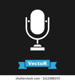 White Microphone icon isolated on black background. On air radio mic microphone. Speaker sign.  Vector Illustration