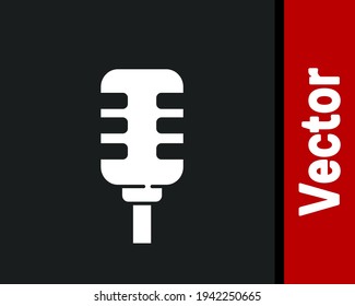 White Microphone icon isolated on black background. On air radio mic microphone. Speaker sign.  Vector