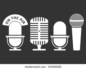 White microphone icons on dark background, vector eps10 illustration