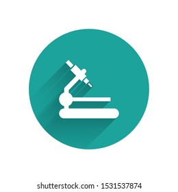 White Microscope icon isolated with long shadow. Chemistry, pharmaceutical instrument, microbiology magnifying tool. Green circle button. Vector Illustration White Microscope icon isolated with long shadow. Chemistry, pharmaceutical instrument, microbiology magnifying tool. Green circle button. Vector Illustration
