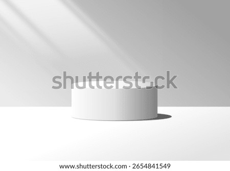 White minimalist cylindrical podium with soft natural lighting and shadows on a gray background. Empty product display stand, perfect for showcasing cosmetics, electronics, or premium items.