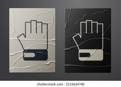 White MMA glove icon isolated on crumpled paper background. Sports accessory fighters. Warrior gloves. Paper art style. Vector