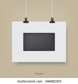 White modern frame hanging on a line. Vector illustration.