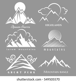 White mountain logo set isolated on grey backdrop. Vector nature labels collection