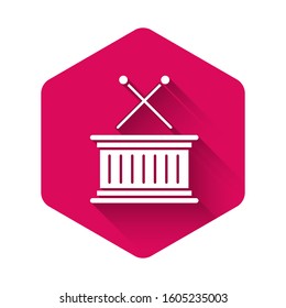 White Musical instrument drum and drum sticks icon isolated with long shadow. Pink hexagon button. Vector Illustration