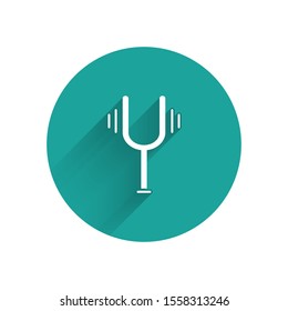 White Musical tuning fork for tuning musical instruments icon isolated with long shadow. Green circle button. Vector Illustration