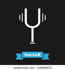 White Musical tuning fork for tuning musical instruments icon isolated on black background.  Vector Illustration