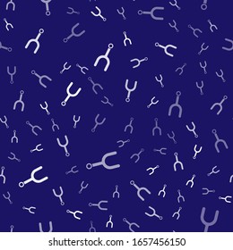 White Musical tuning fork for tuning musical instruments icon isolated seamless pattern on blue background.  Vector Illustration