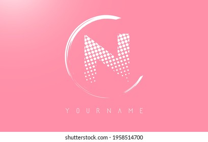 White N letter logo design with golden dots and white circle frame on pink background. Creative vector illustration with pink background and letter N.