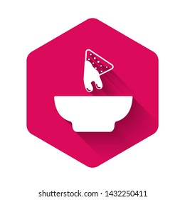 White Nachos in plate icon isolated with long shadow. Tortilla chips or nachos tortillas. Traditional mexican fast food. Pink hexagon button. Vector Illustration