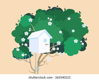 A white nesting box tied to a green blossoming tree