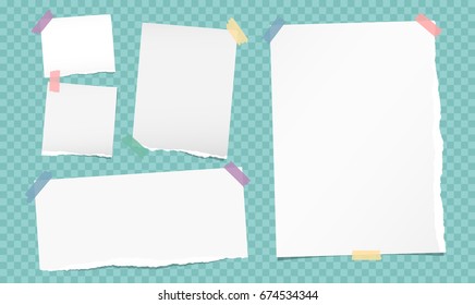 White note, notebook, copybook paper strips stuck with colorful sticky tape on turquoise squared background.