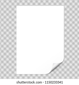 White notebook paper with curled corner for text or advertising message on gray squared background.