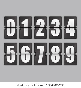 White numbers on a black background. Set with shadows on a gray background. 