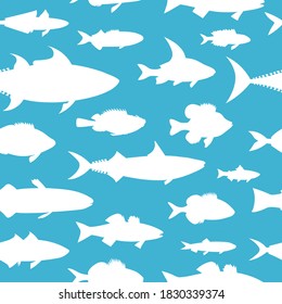 White ocean fish on blue background. Seamless pattern hand drawing vector.