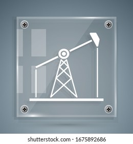 White Oil pump or pump jack icon isolated on grey background. Oil rig. Square glass panels. Vector Illustration