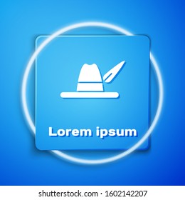 White Oktoberfest hat icon isolated on blue background. Hunter hat with feather. German hat. Blue square button. Vector Illustration