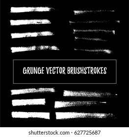 White on black set of vector grunge brushstrokes or backgrounds. Hand painted black ink brush strokes, brushes, and lines. Dirty grunge artistic design elements. Backgrounds for text.