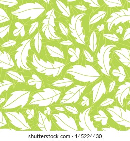 White on green leaves silhouettes seamless pattern background