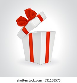 White open gift box with red ribbon and bow.