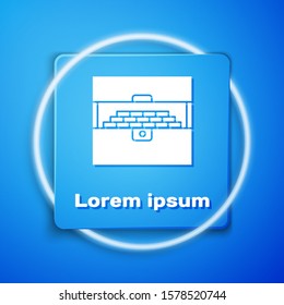 White Opened antique treasure chest icon isolated on blue background. Vintage wooden chest with golden coin. Blue square button. Vector Illustration