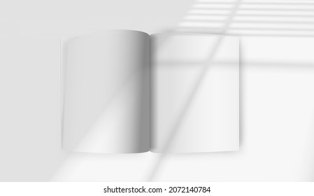 White opened book mockup with sun flare effect. Light of the window with blinds