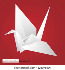 white origami bird on red background