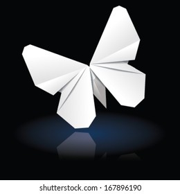 White origami butterfly on dark background