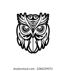 ﻿Black and white owl tattoo adorned with Polynesian patterns.