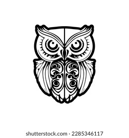 ﻿Black and white owl tattoo with Polynesian designs.