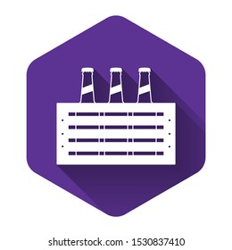 White Pack of beer bottles icon isolated with long shadow. Wooden box and beer bottles. Case crate beer box sign. Purple hexagon button. Vector Illustration