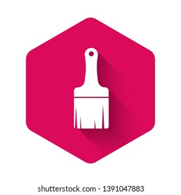 White Paint brush icon isolated with long shadow. Pink hexagon button. Vector Illustration