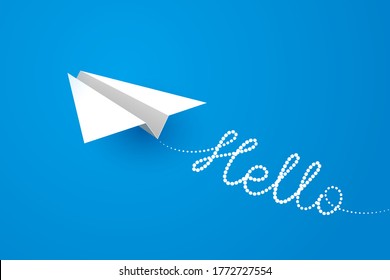 White paper airplane is flying forward over blue background, white contrail is shaped like word Hello. Concept of business startup, start of vacation, ready to travel and new ventures