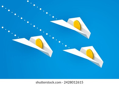 White paper airplanes with gold coins are flying over blue background. Concept of money transfers, transactions, online payments, business and financial issues