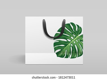 Diseño frontal de bolsos de papel blanco, con impresión de hojas de monstera, plantilla sobre fondo gris Eps 10 ilustración vectorial