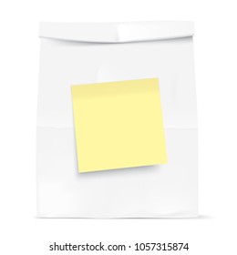 White paper bag isolated on background. Grocery kraft bag with yellow sticky note. Bag template.