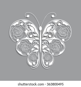White paper butterfly with floral pattern on gray background.