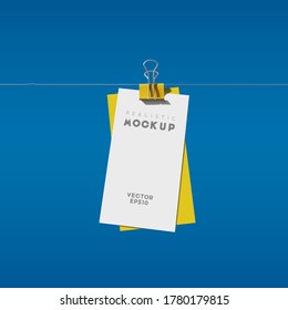  White paper card with binder clip on blue background. Realistic mockup vector illustration.